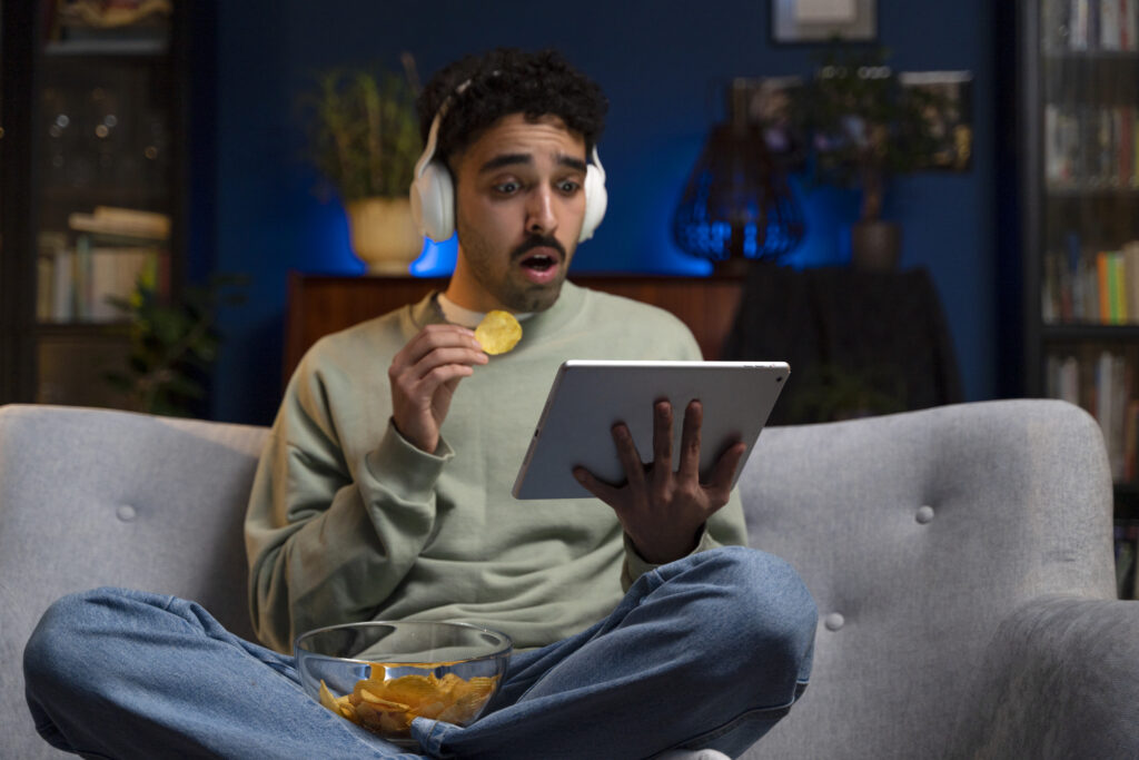 young-man-enjoying-movie-night